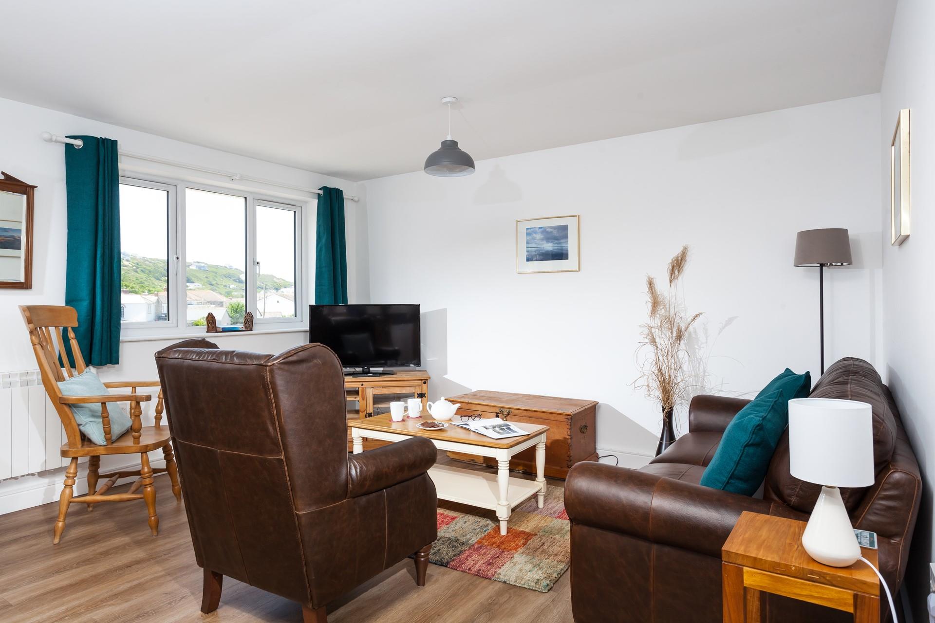 The sitting room is comfortable for spending cosy evenings in.