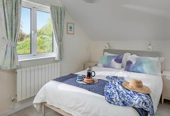 Settle into the soft sheets of the king size bed and drift off to sleep.