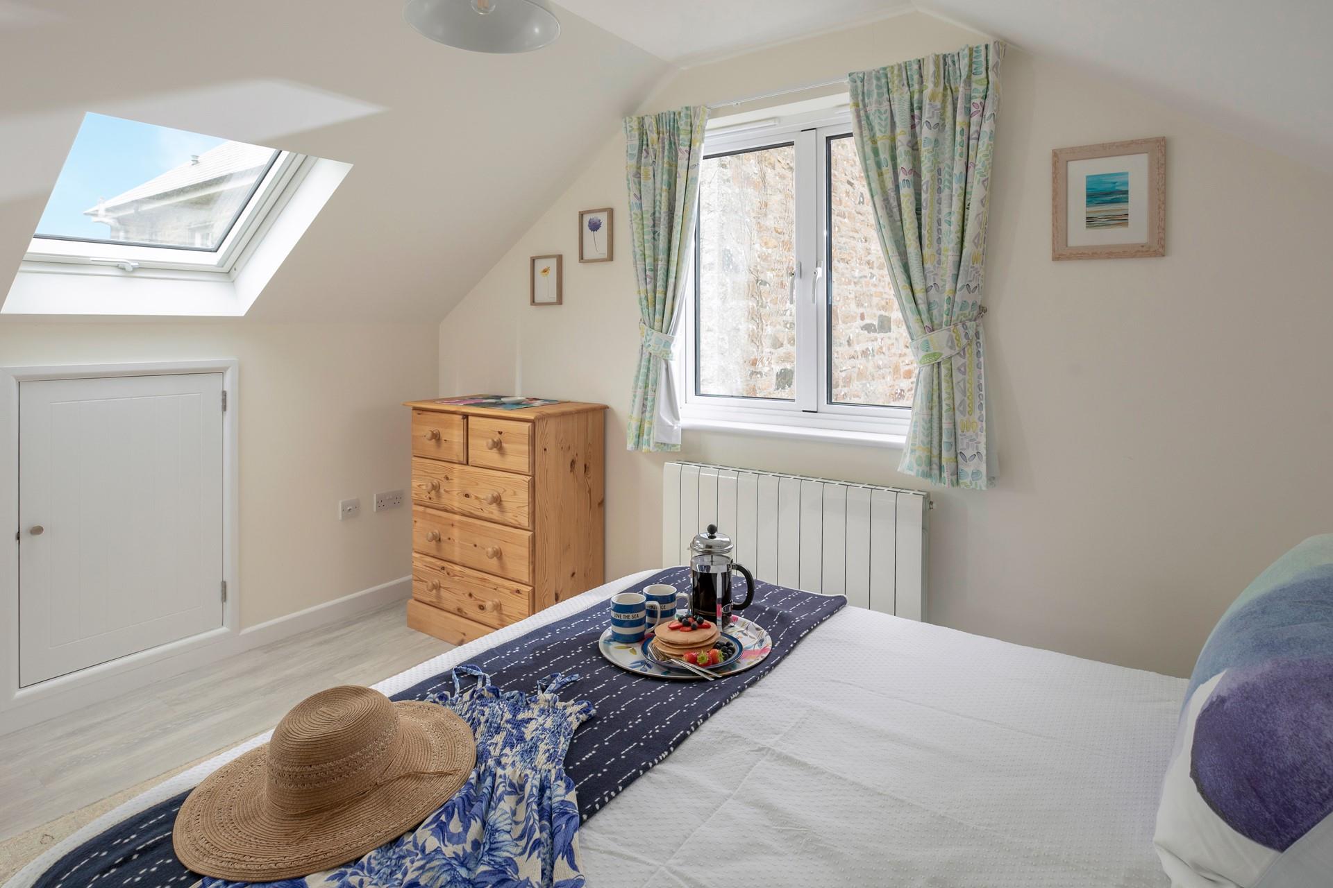 The sumptuous king size bed offers a luxurious night's slumber.