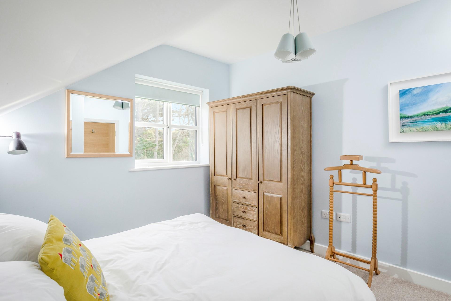 There is plenty of furniture for packing away belongings.