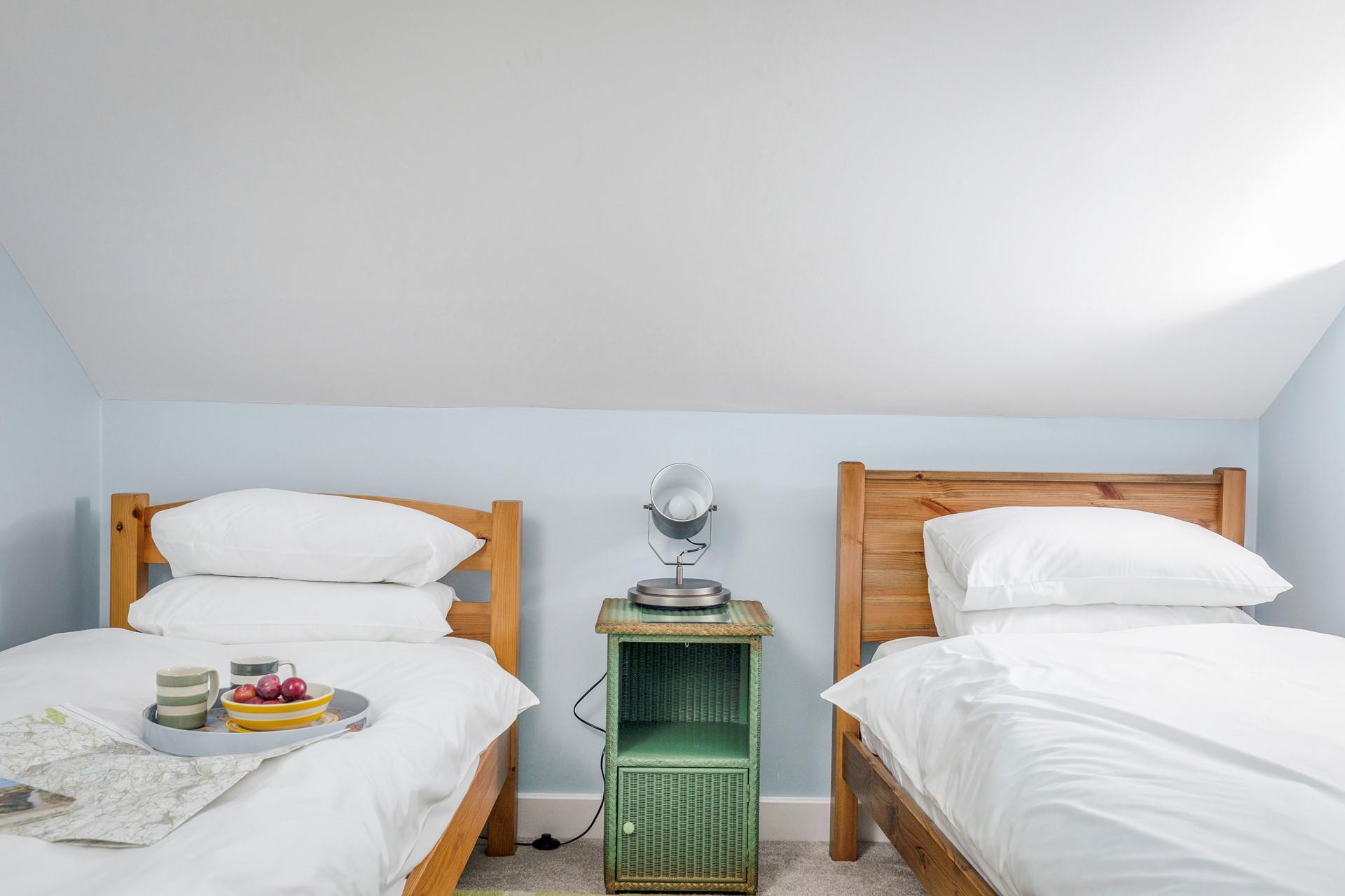 Bedroom 3 is simply decorated and a calming space to relax.