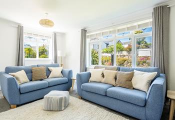 The sitting room has sumptuous sofas to unwind after days exploring the west coast.