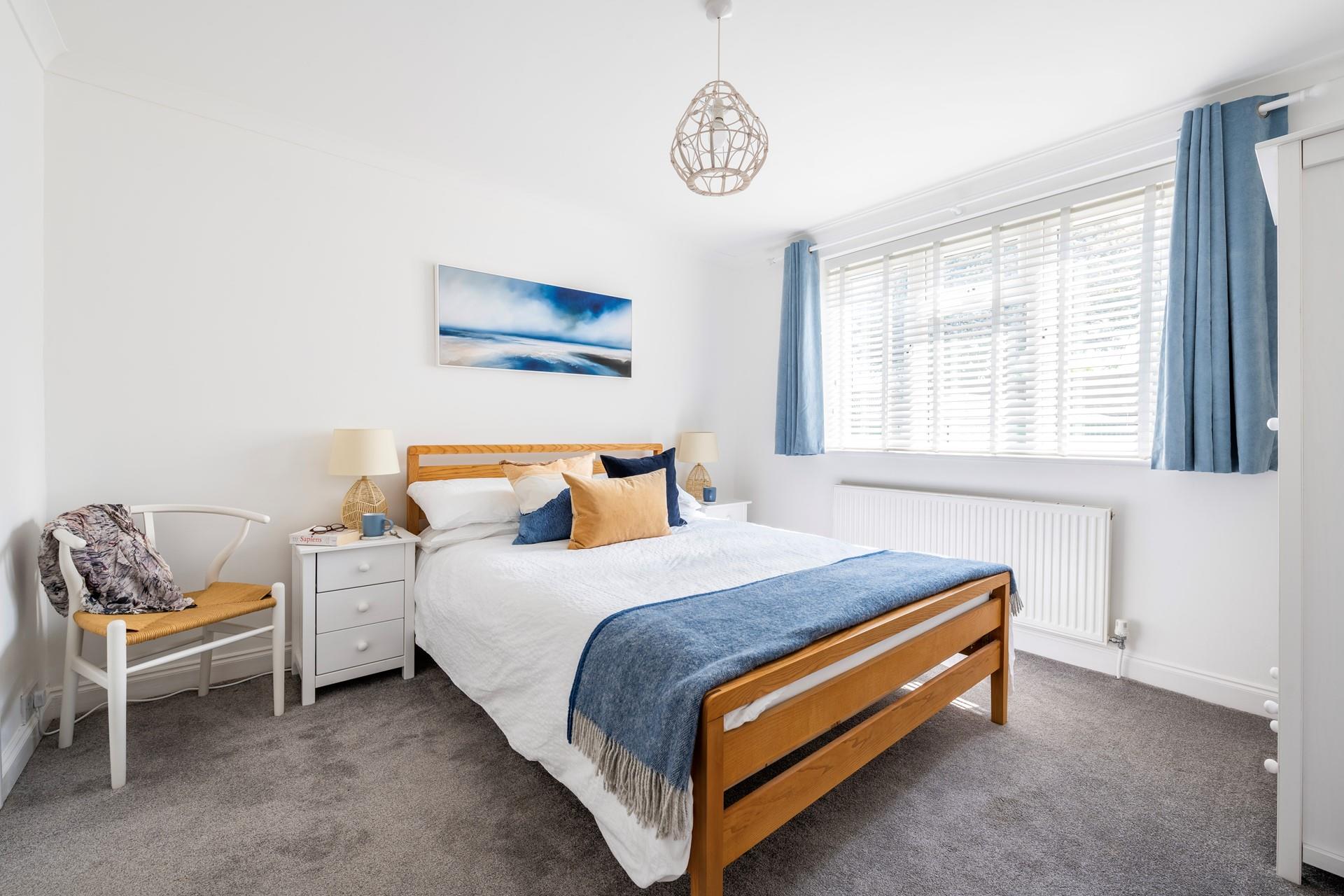 Bedroom 3 is decorated with seaside blues and yellows.