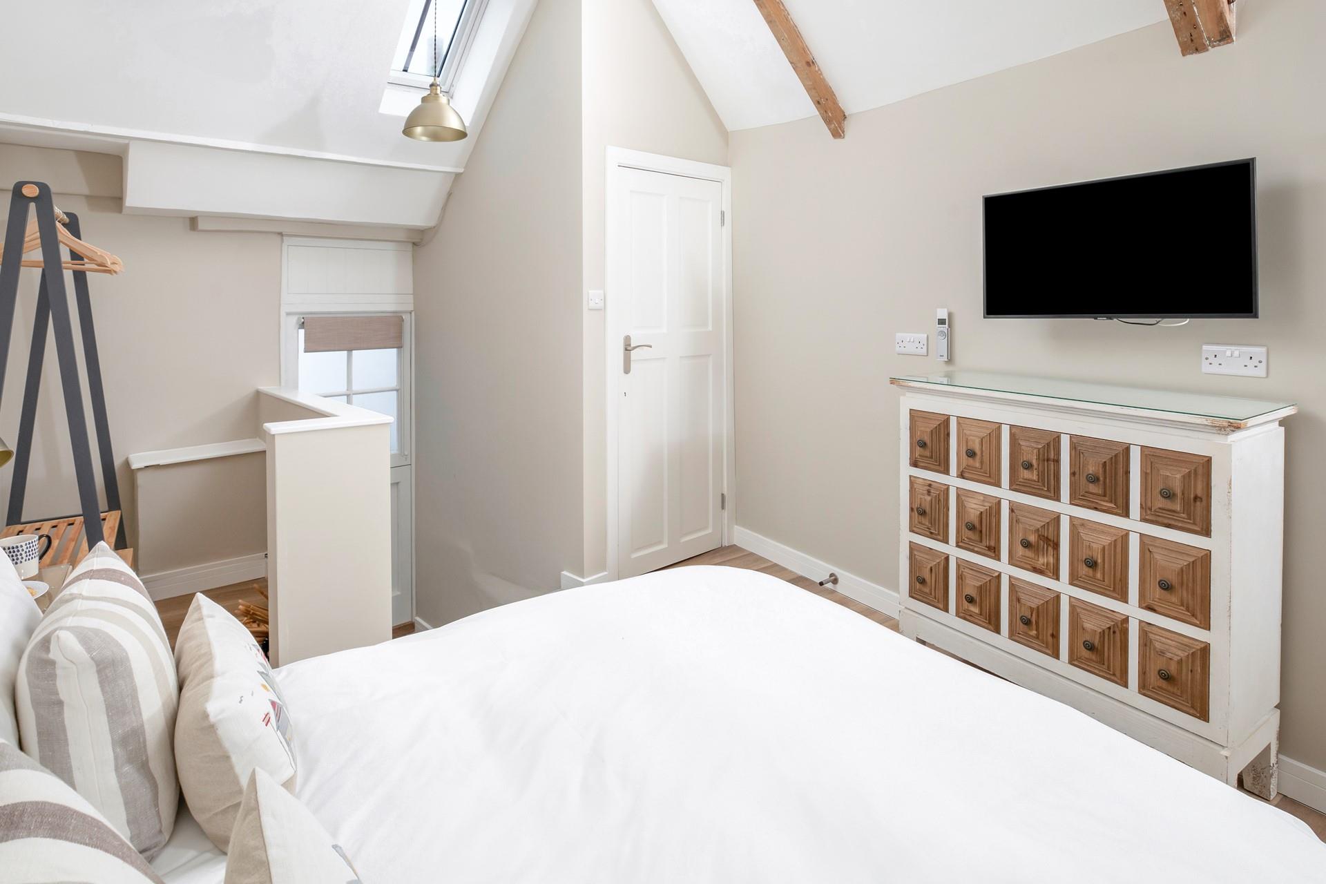 The sumptuous king size bed offers a relaxing night's slumber.