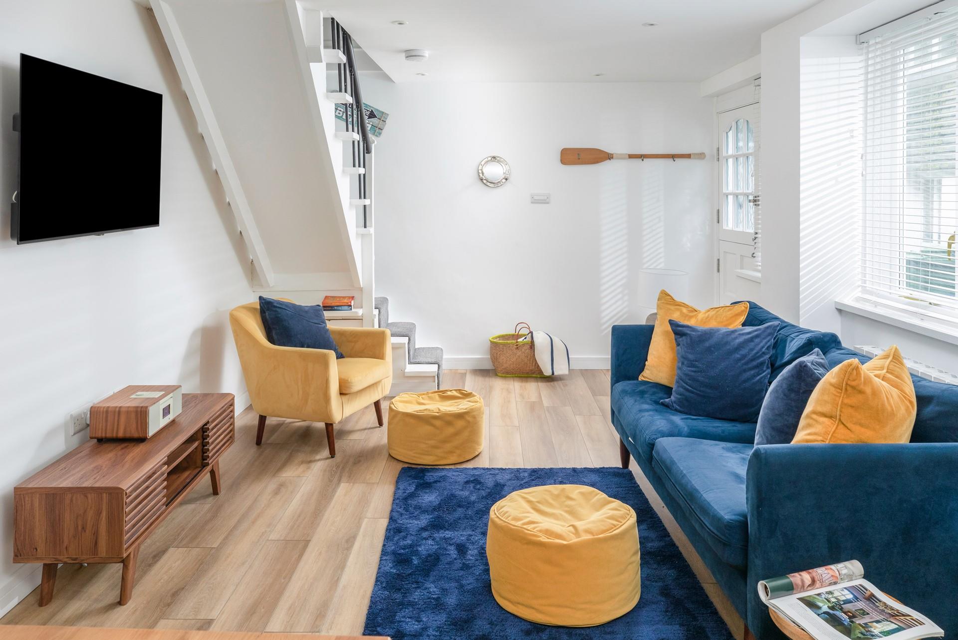 Sink into the plush sofas and relax in front of the Smart TV after a day on the beach.