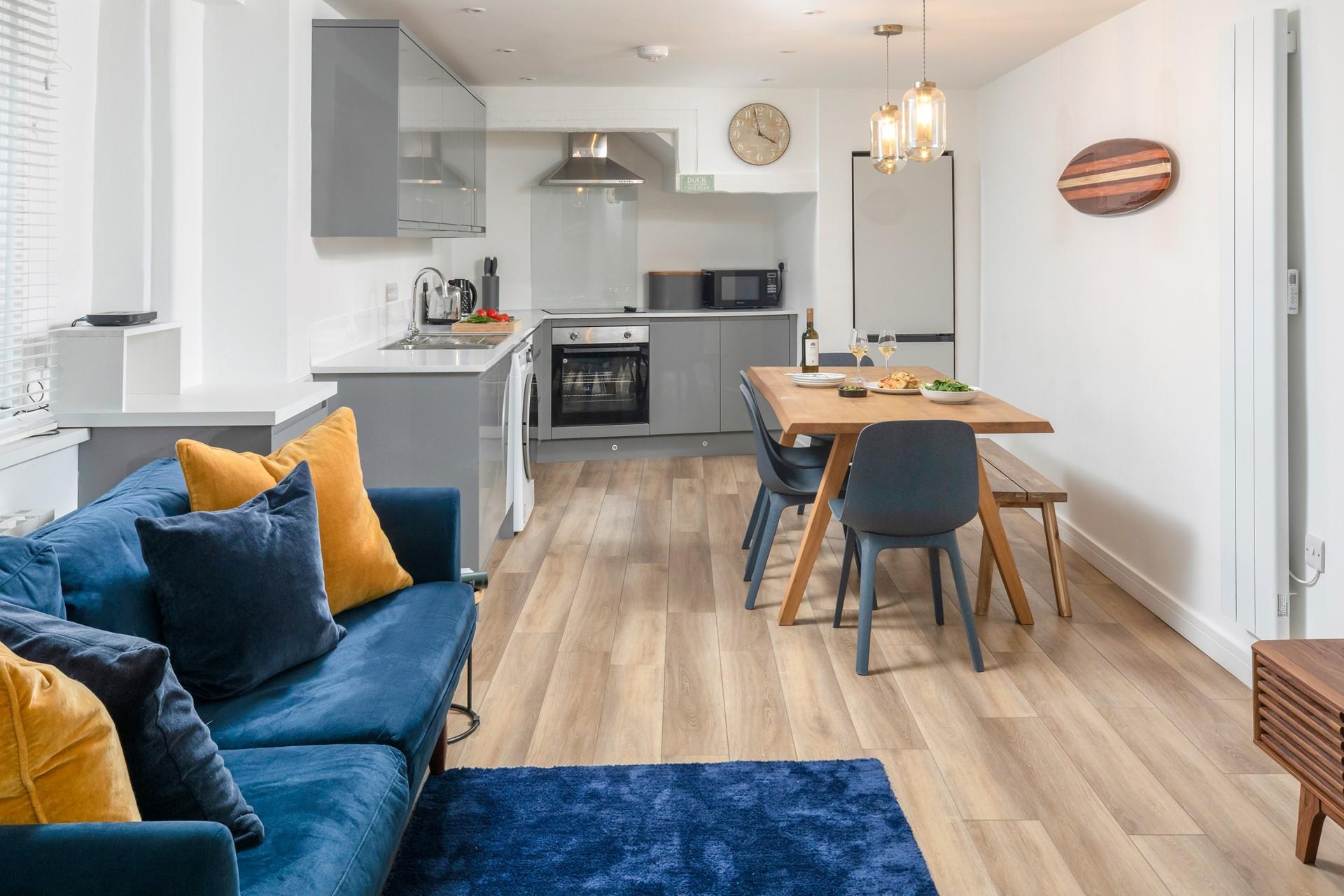 Skippers Den is decorated with ocean blues and yellows reflecting the seaside location.