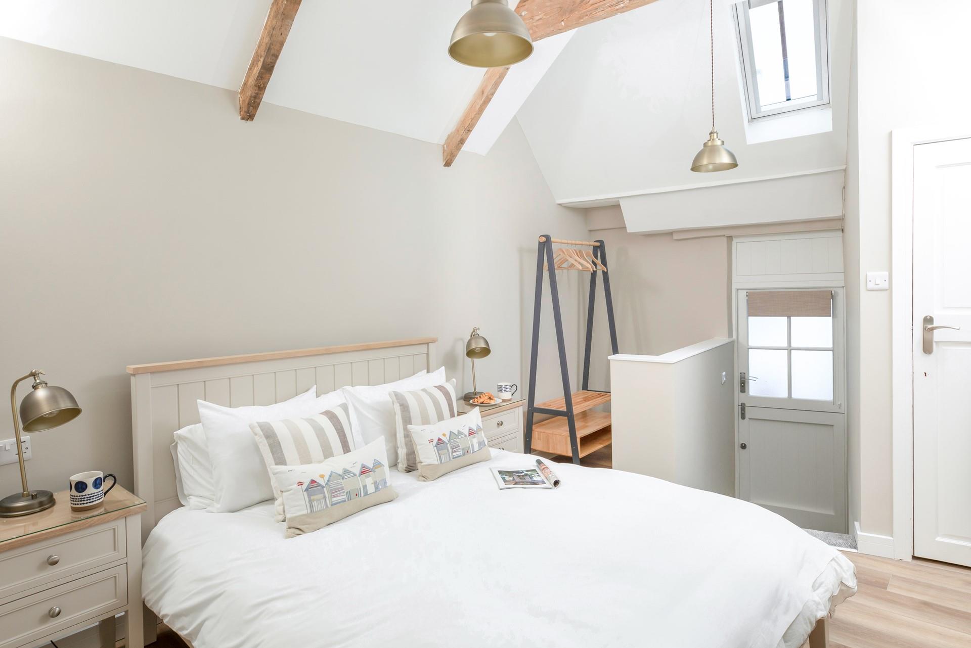 Bedroom 2 has a handy storage room for hanging clothes and keeping suitcases.