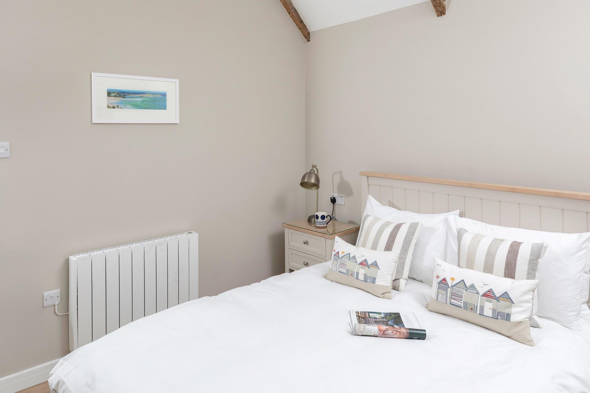 Relax and unwind in the sumptuous bed.