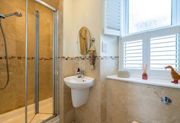 The en suite shower room provides plenty of space to get ready in the morning.