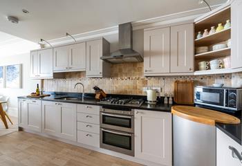 The kitchen has plenty of worktop space to cook meals and prepare picnics.