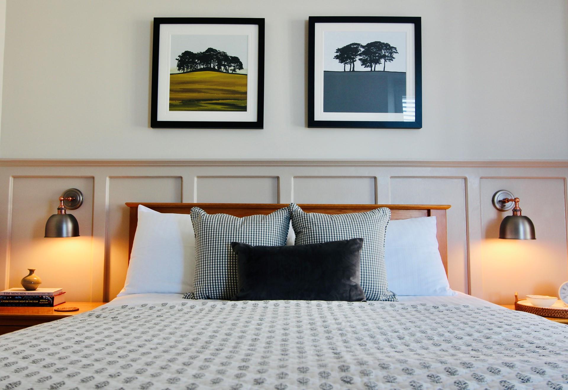 Stylish artwork depicts the Cornish landscapes in the main bedroom.