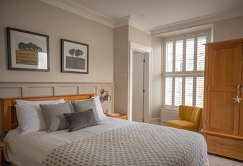 The king bedroom has a calming and restful colour palette.