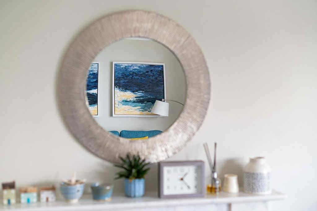 Beautiful coastal artwork brings a touch of the nearby beach inside.
