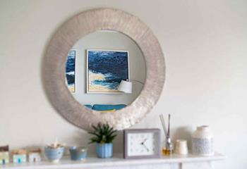 Beautiful coastal artwork brings a touch of the nearby beach inside.