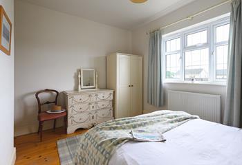 The bedrooms each have a wardrobe and chest of drawers.