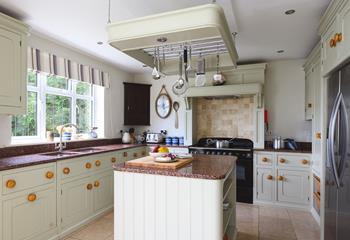 The kitchen is large and fully equipped to rustle up delightful meals.
