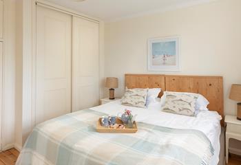 The bedrooms are simply decorated with neutral tones.