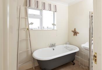 The family bathroom has a free-standing bath for relaxing soaks in the bubbles.