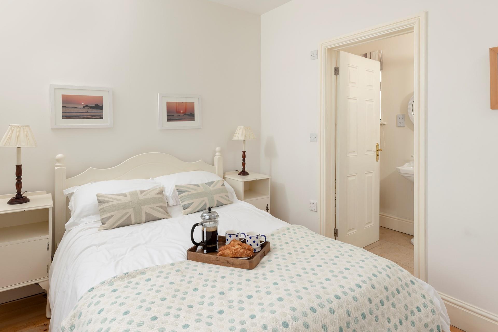 The bedrooms each have a wardrobe and a chest of drawers.