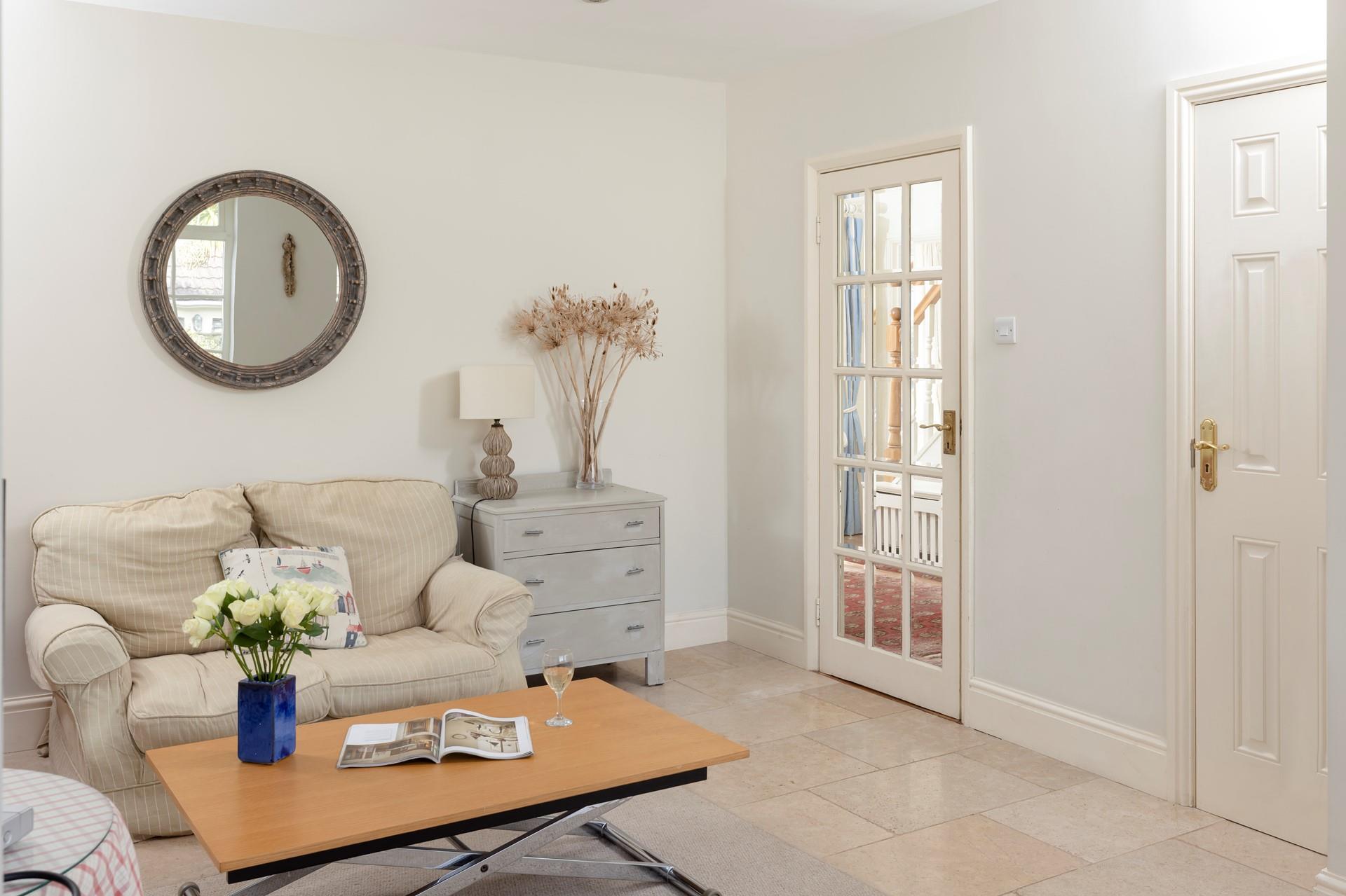 Get stuck into a good book in the sitting room.