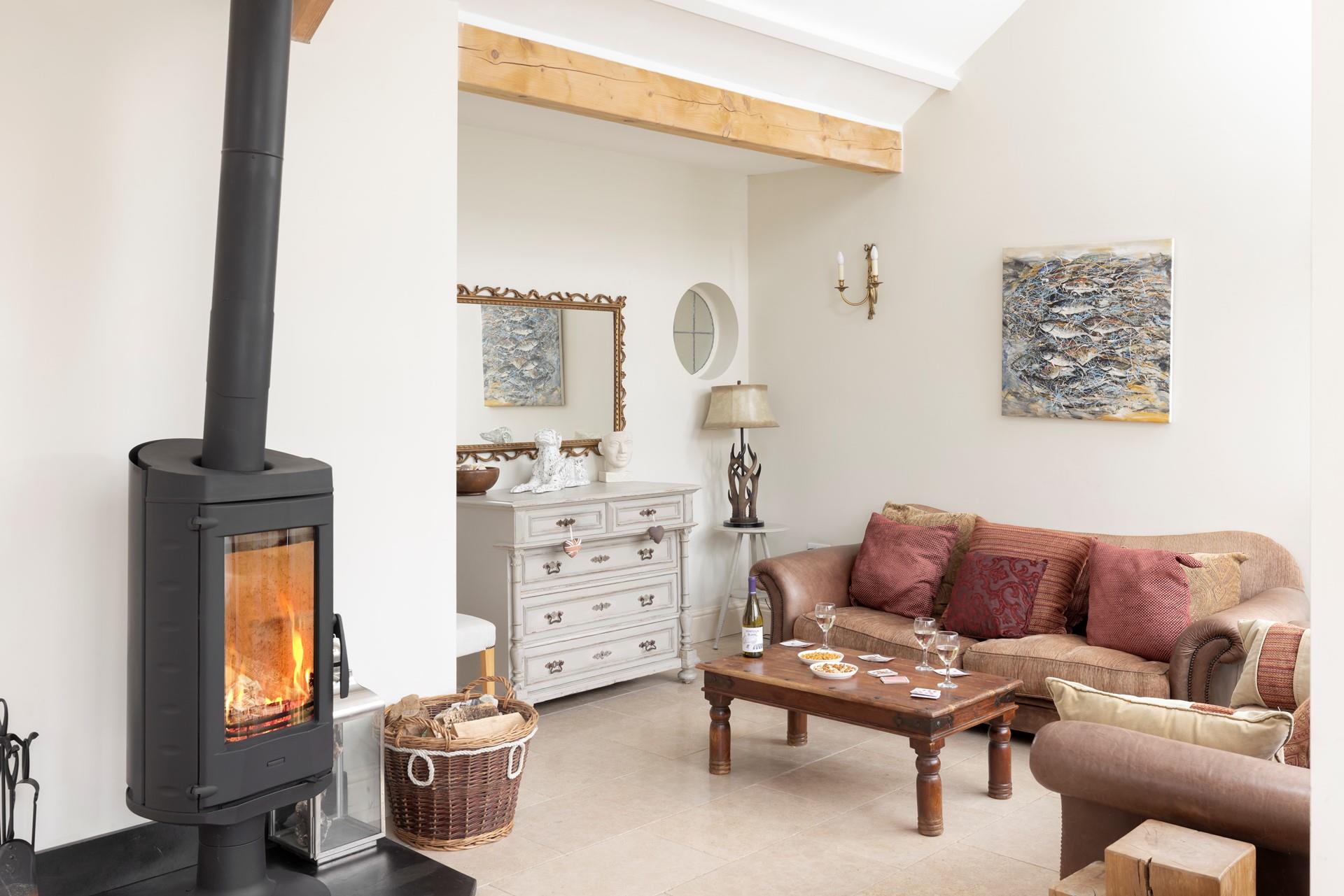 Cosy up in front of the rotating woodburner after a wintery walk on the beach.