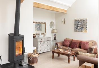 Cosy up in front of the rotating woodburner after a wintery walk on the beach.