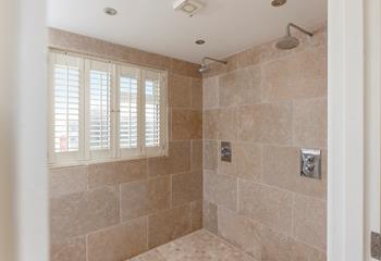 The wetroom has a double rainfall shower for rinsing off after dips in the sea.