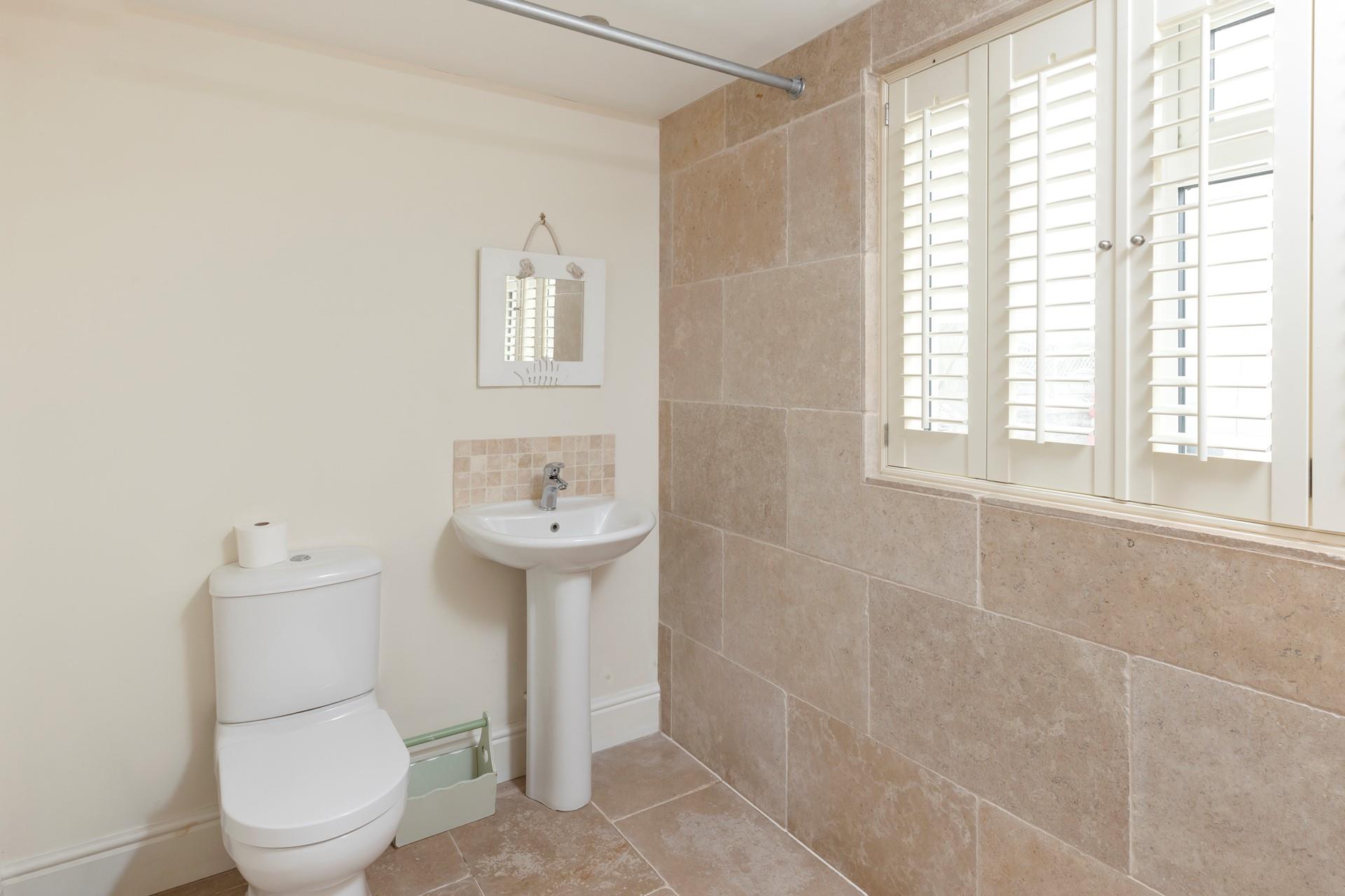 Wash off sandy toes in the shower after a day on Crooklets.