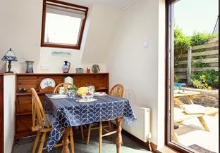 Sit around the table and tuck into a delicious meal after a day on the beach.
