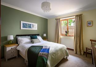 Wake up and sip your first coffee of the day in the comfortable double bed.