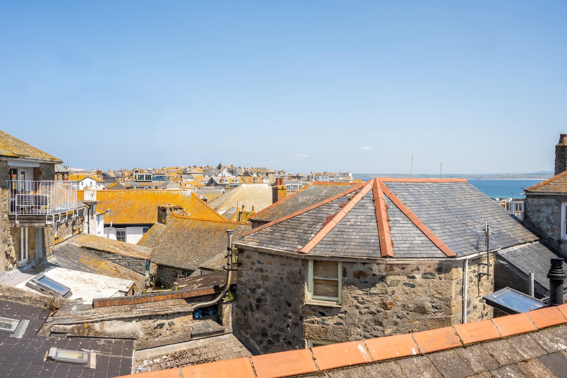 Sea glimpses across St Ives' quirky rooftops.