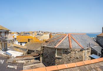 Sea glimpses across St Ives' quirky rooftops.