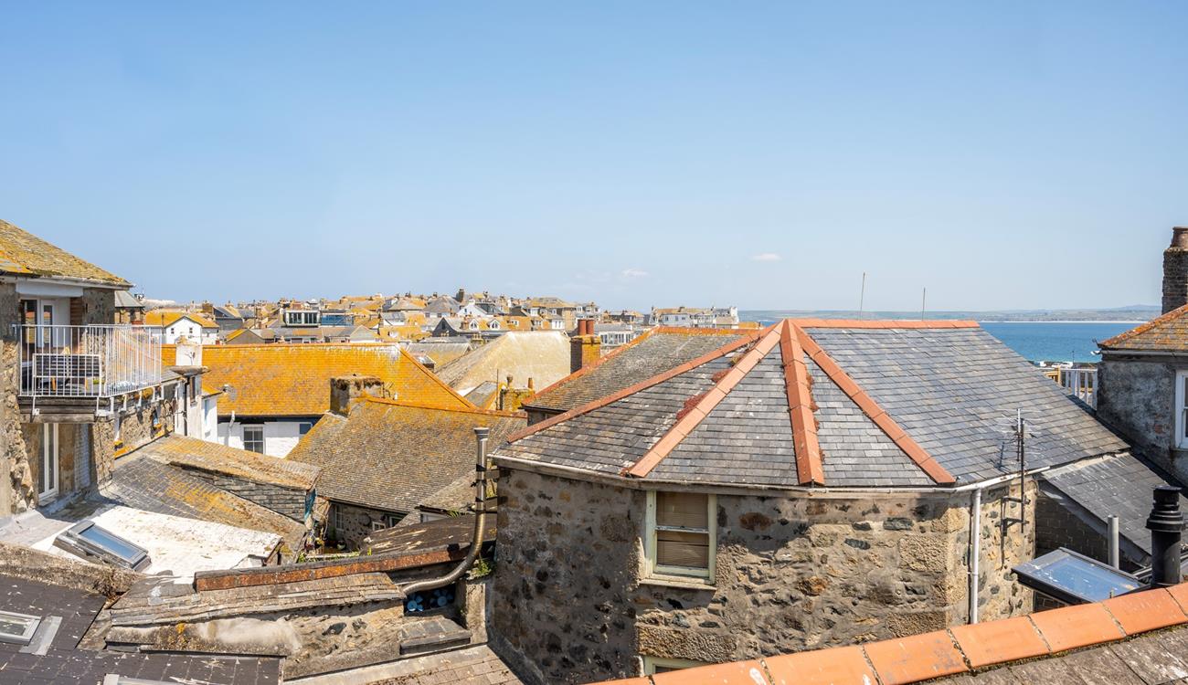 Sea glimpses across St Ives' quirky rooftops.