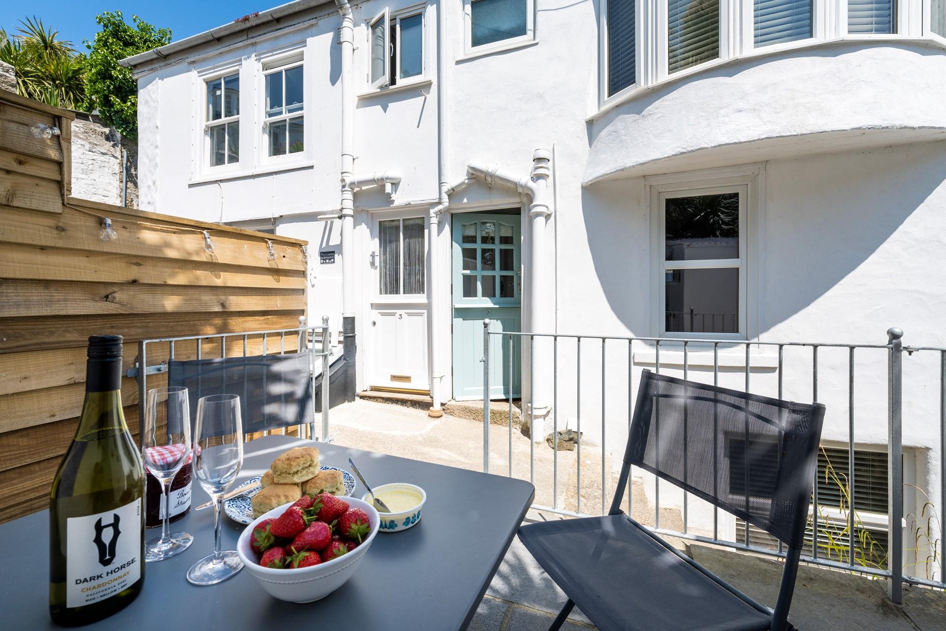 Tuck into a Cornish cream tea on the outdoor patio.