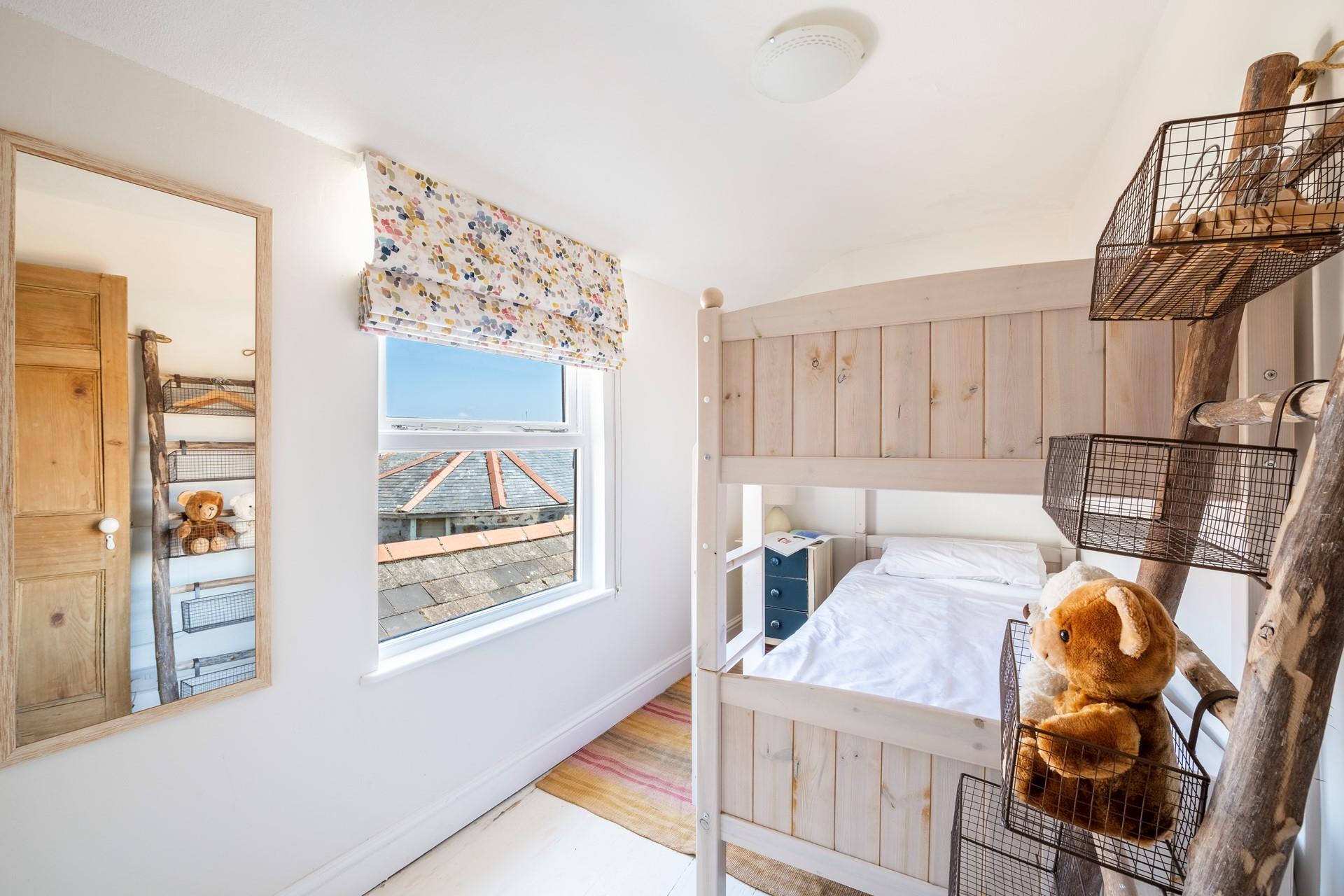 The bunk room has views across rooftops to the harbour.