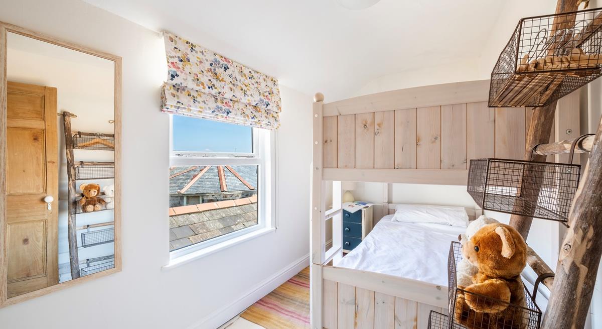 The bunk room has views across rooftops to the harbour.