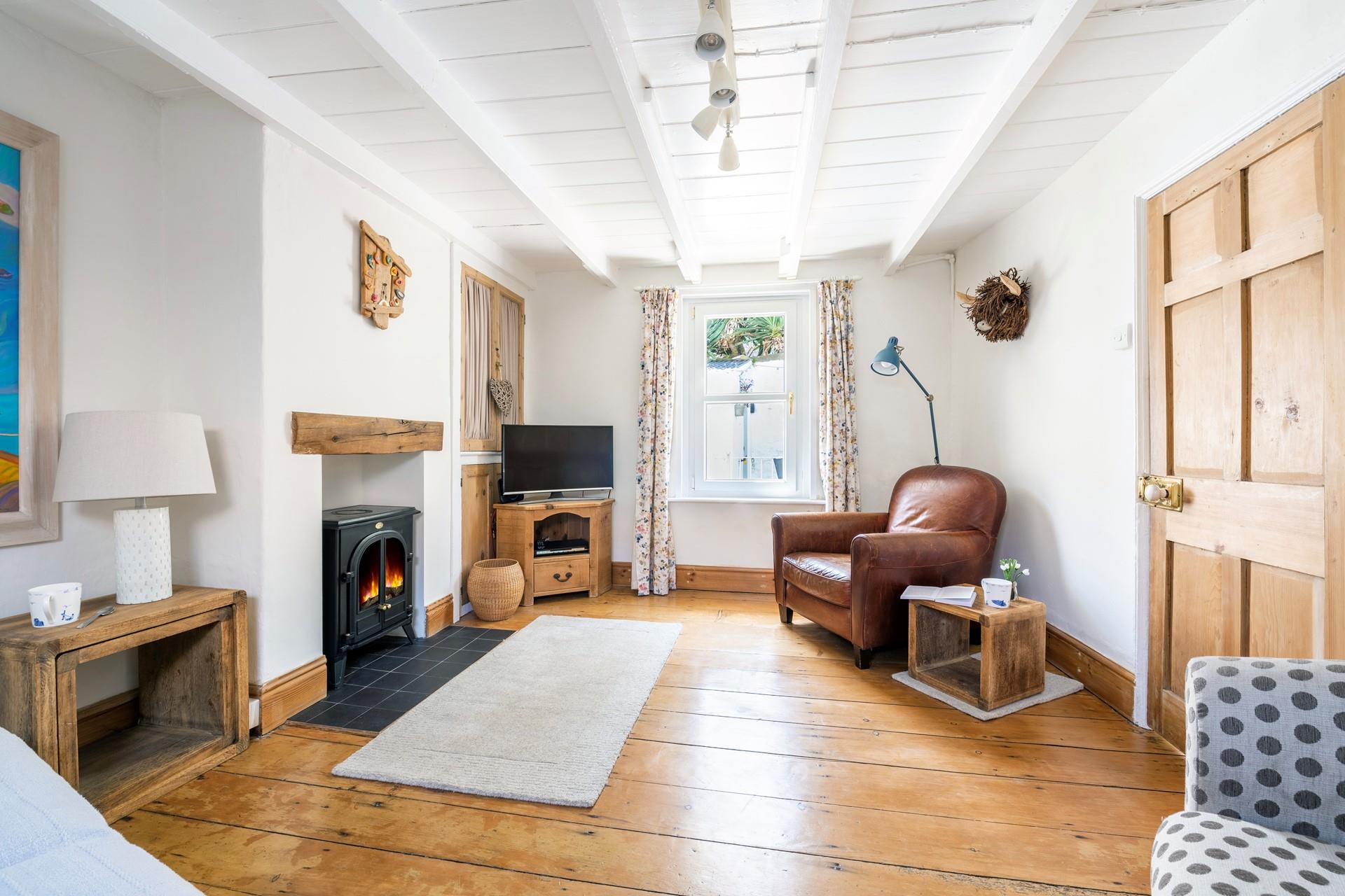 The sitting room is spacious with room for the whole family to relax.