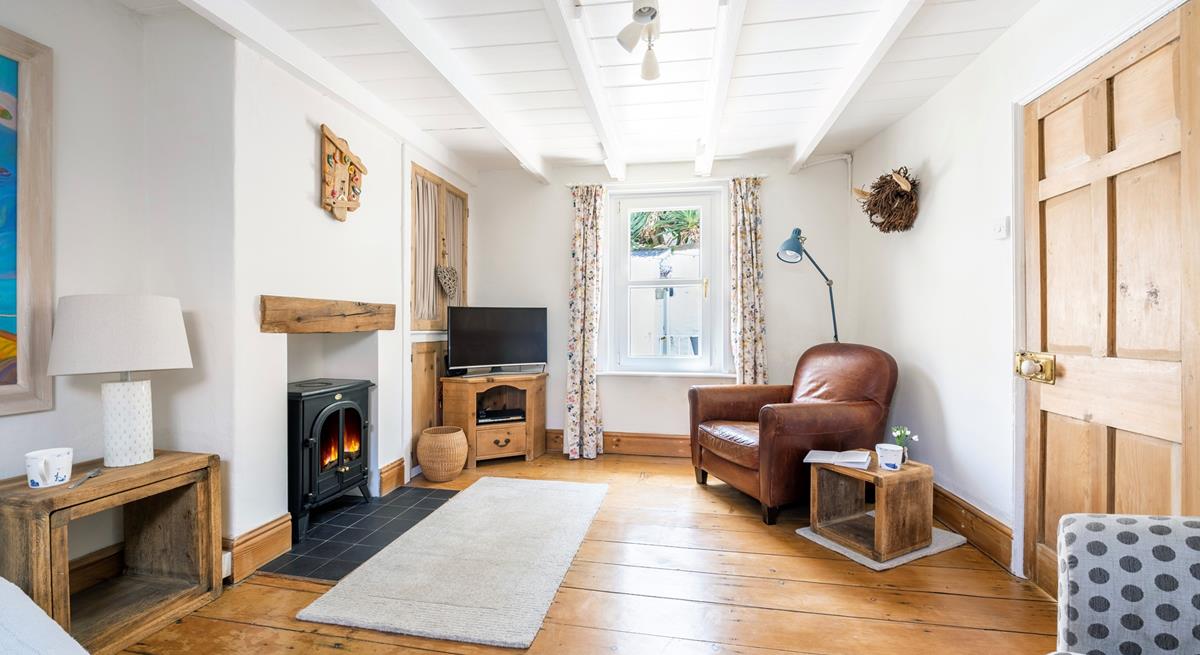 The sitting room is spacious with room for the whole family to relax.