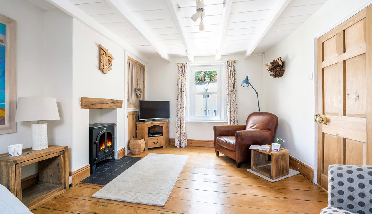 The sitting room is spacious with room for the whole family to relax.