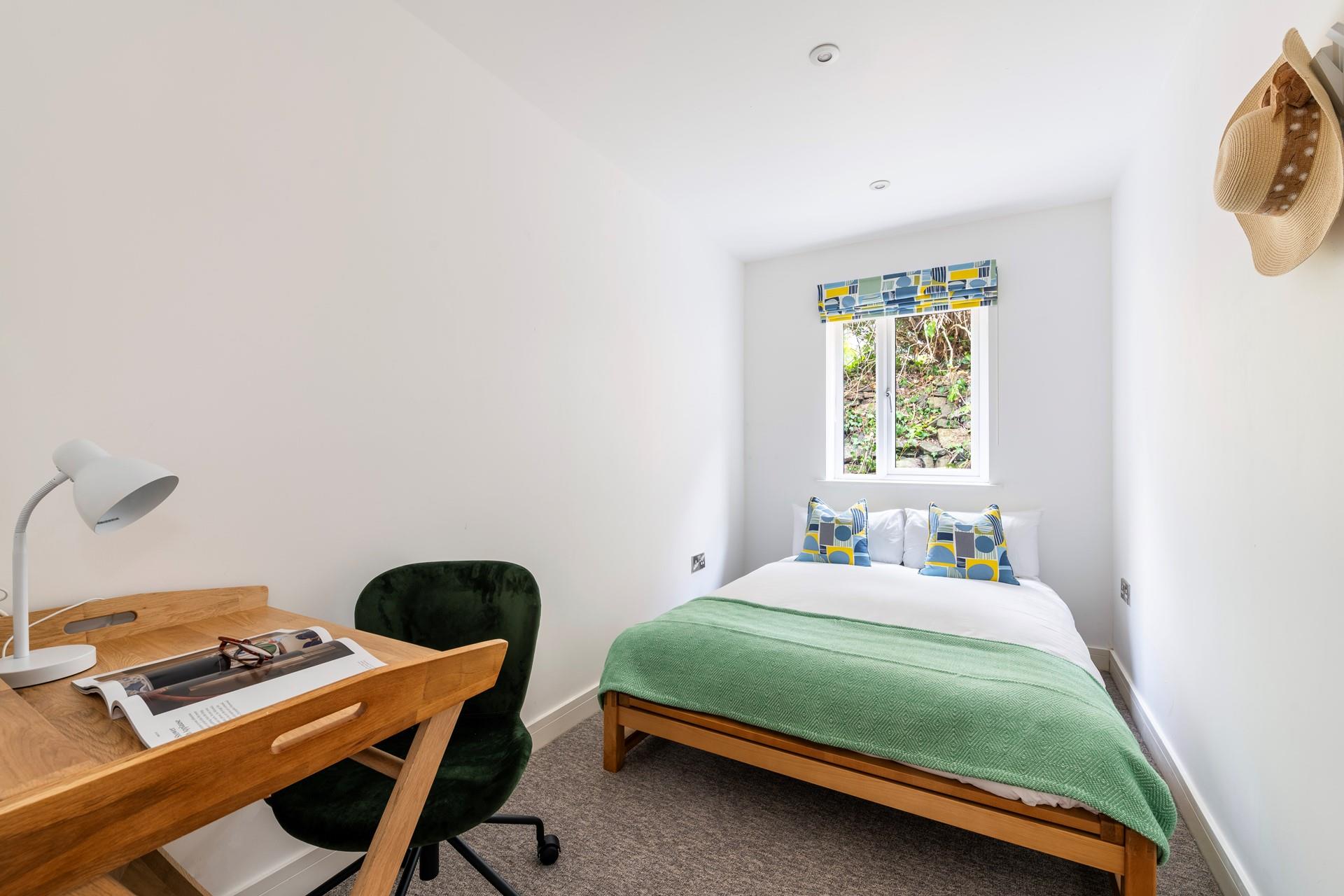 Catch up on some emails at the desk.