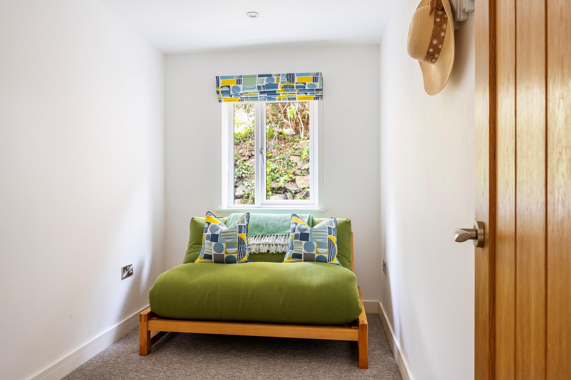 The sofa bed provides additional sleeping arrangements for guests.