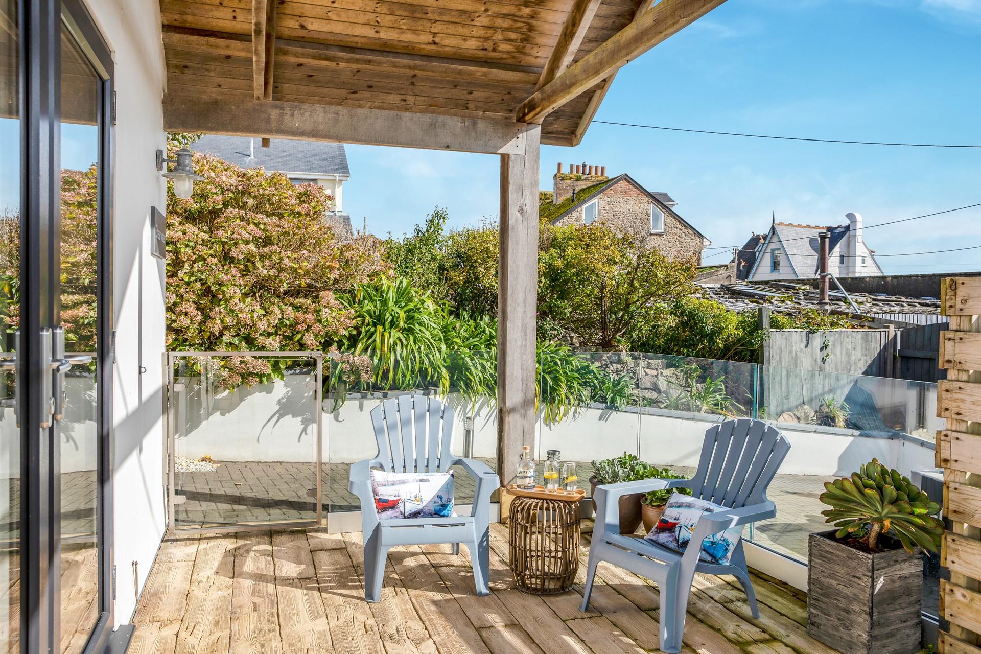 Sip a cold G&T as the sun goes down, after enjoying a day on the beach.