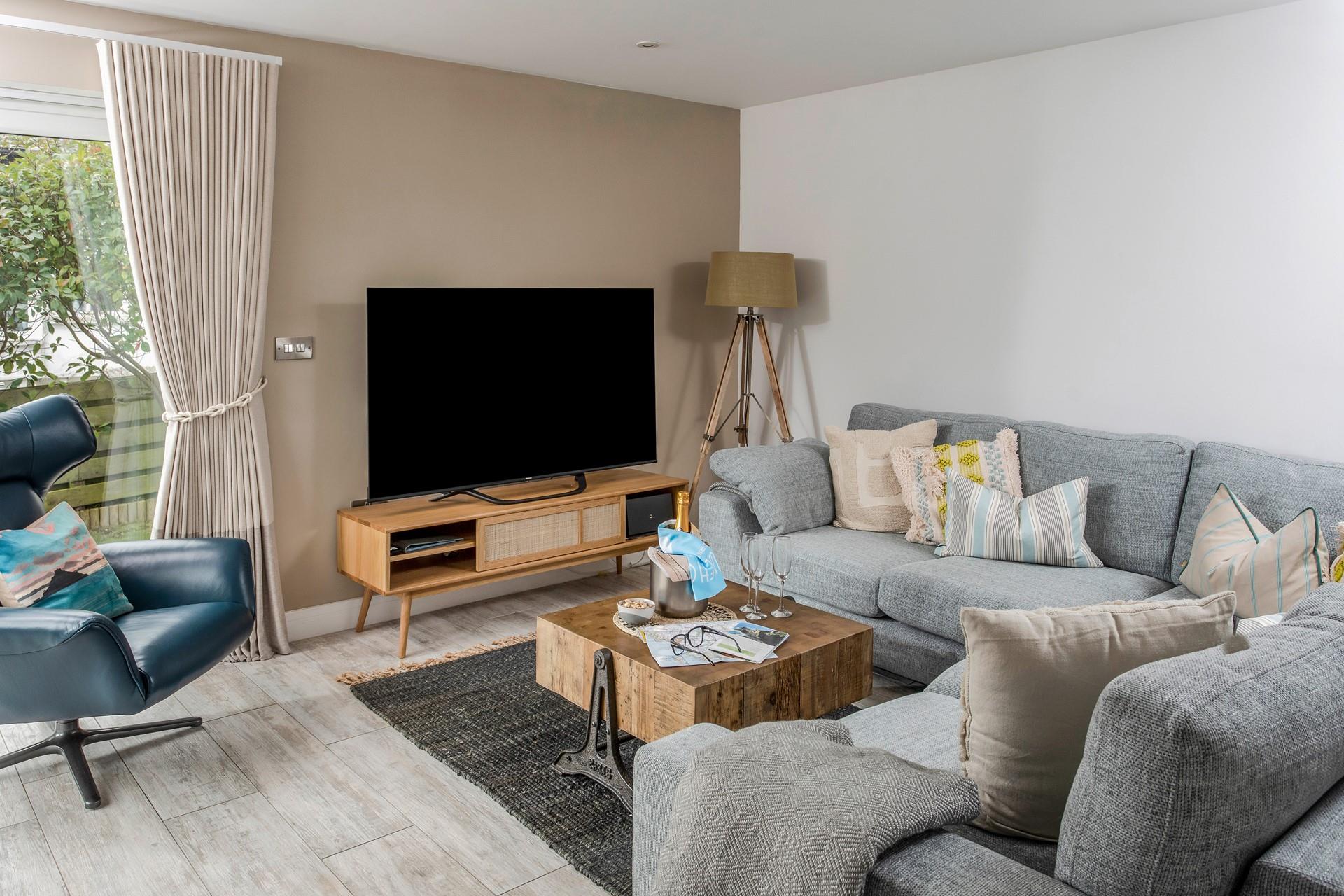 Gather the family around for a movie night in the sumptuous sitting room.