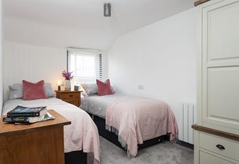 Bedroom 2 has twin beds, perfect for young adults or children.