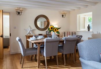 Tuck into a delightful dinner around the stylish dinner table.