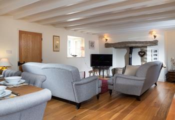 Snuggle up in the cosy sitting room after a day of exploring the quaint villages on the south coast.