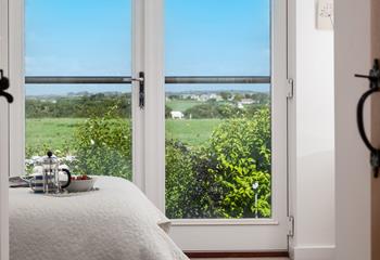 Wake up and enjoy countryside views from the Juliette balcony.