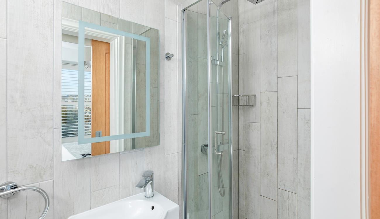 Step into the modern rainfall shower.