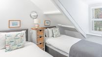 The twin beds are perfect for young adults or children.