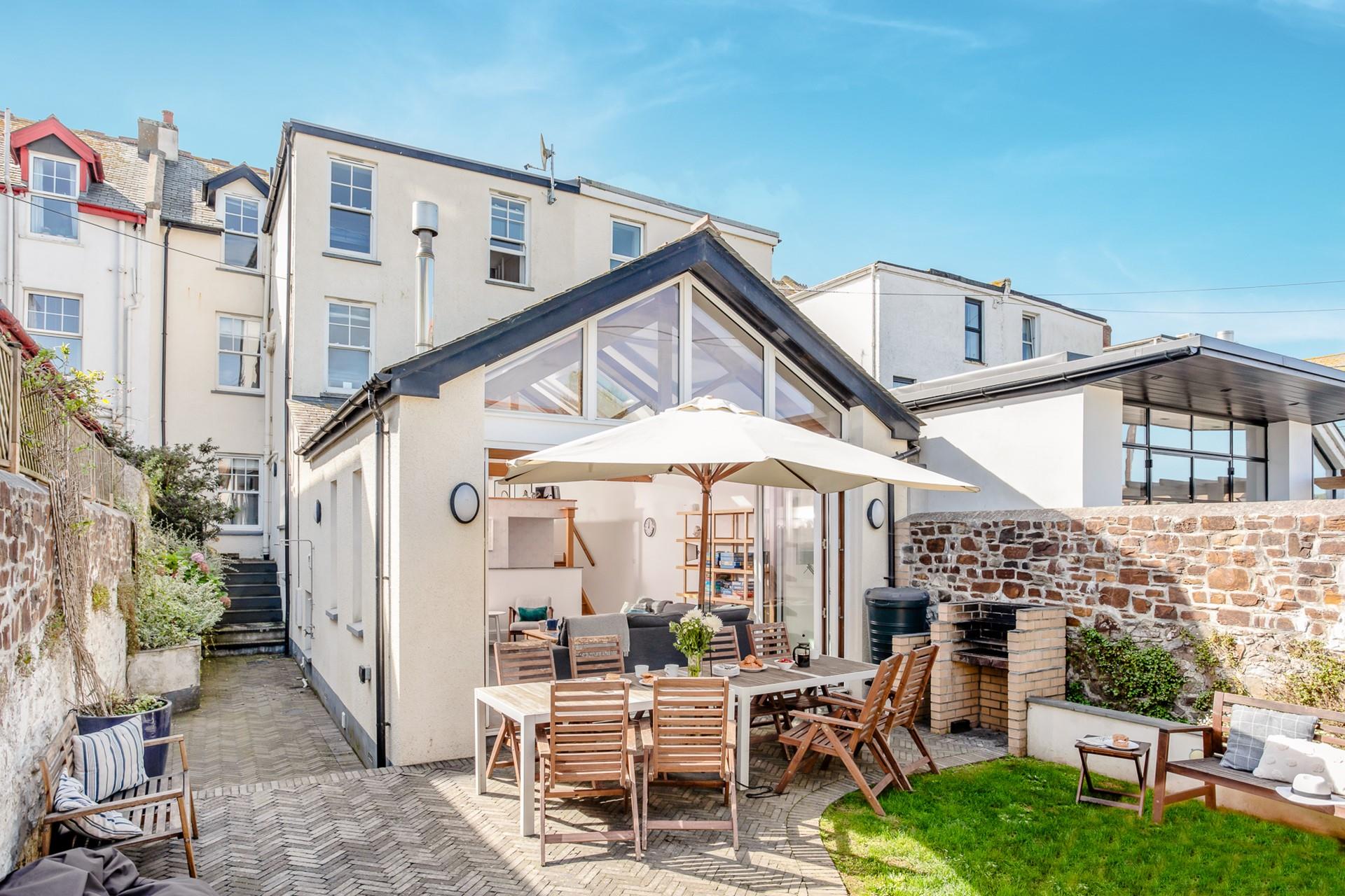 Watch your furry friends and the little ones play in the garden on a summer afternoon.